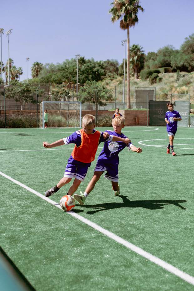 Two players challenging for the ball
