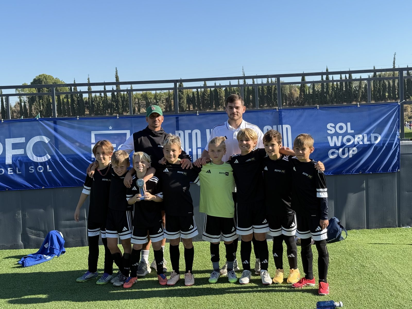 The squad with a trophy at the PFC Sol World Cup
