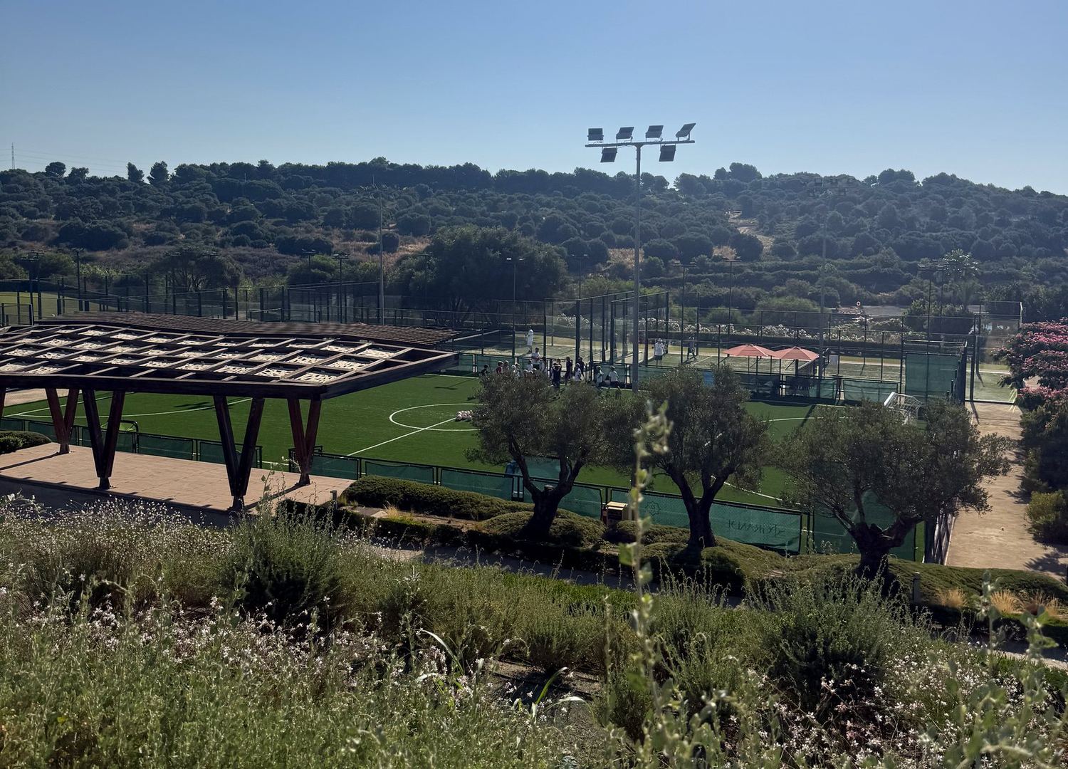 The pitch at La Reserva Club seen from the hillside above.